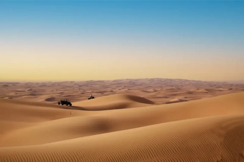 Two-seater buggy exploring remote Dubai desert dunes on a Max Adventure tour with desert thrill